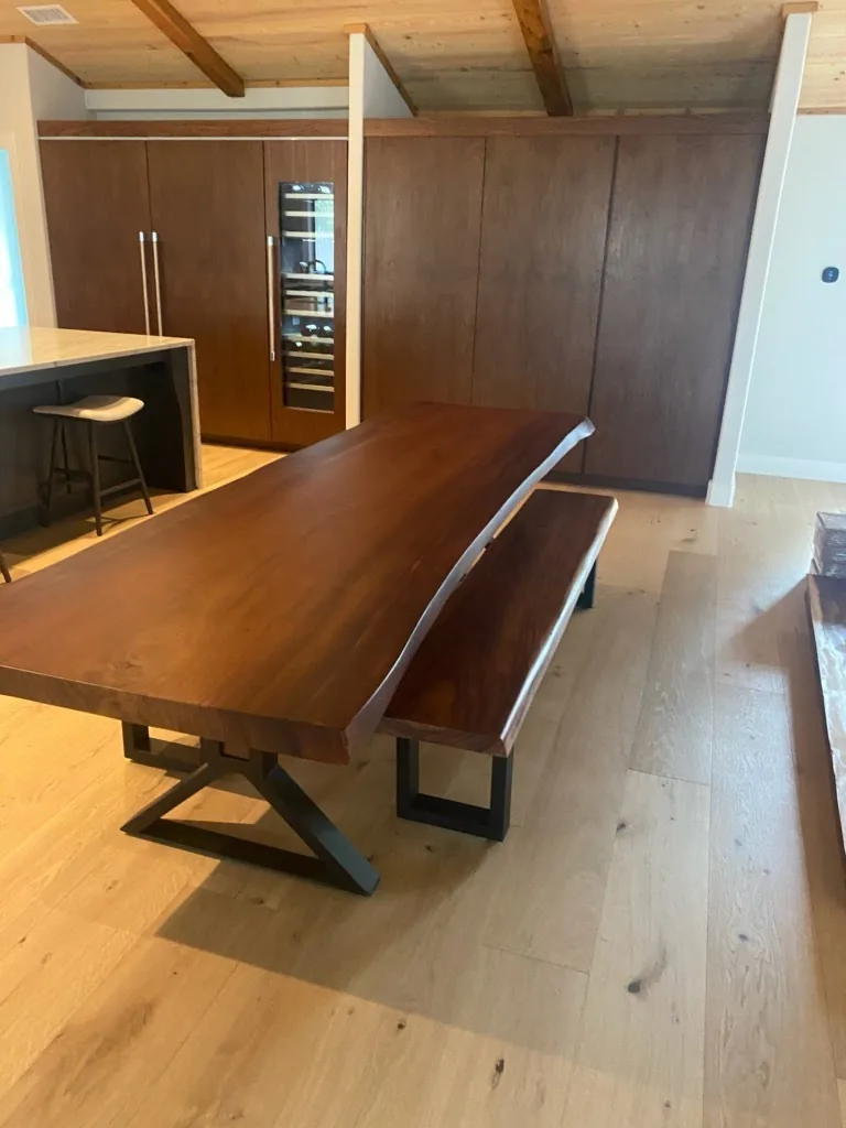 Live edge dining table and matching bench in a modern home